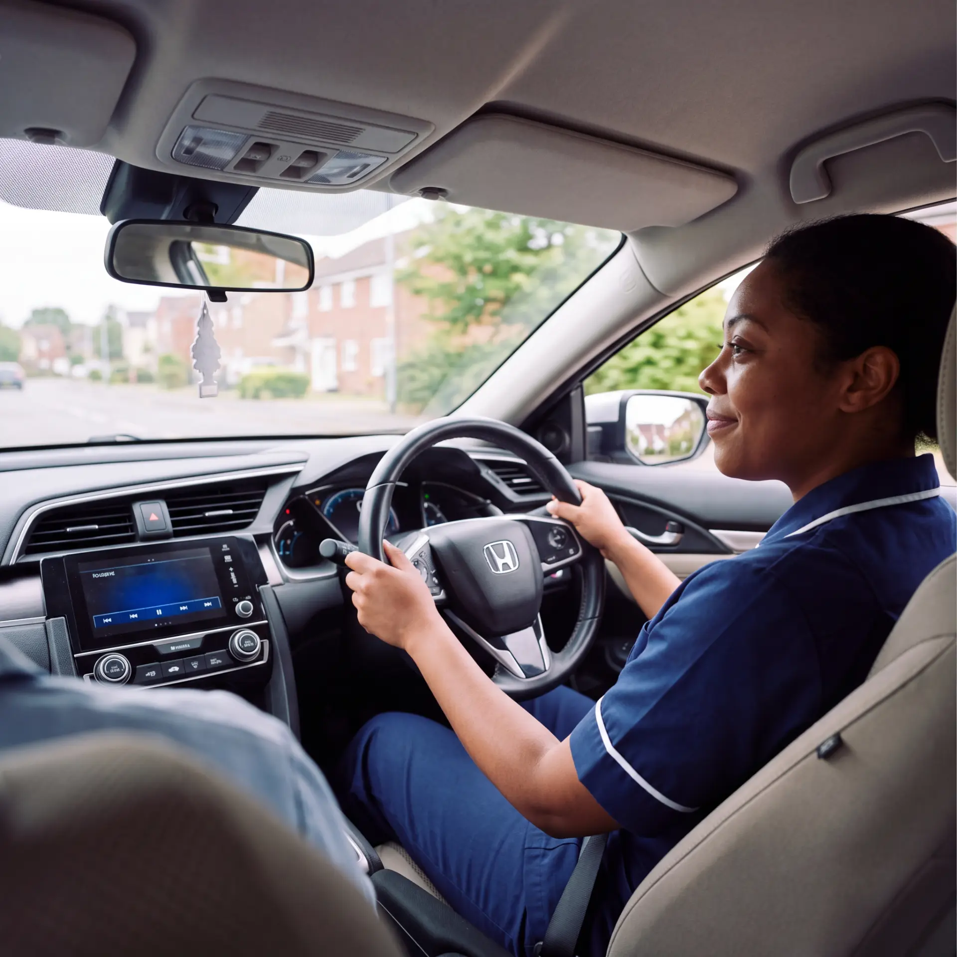 NHS staff member driving a car financed through Vizion Finance
